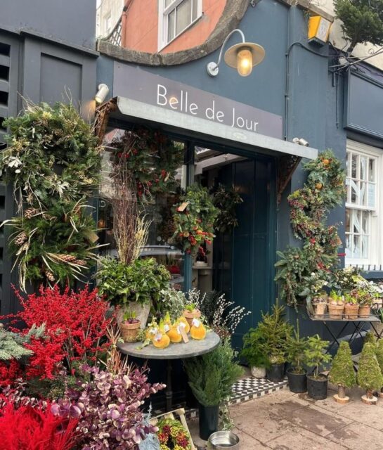 The exterior of Belle de Jour in Clifton, Bristol, with lots of plants and flowers