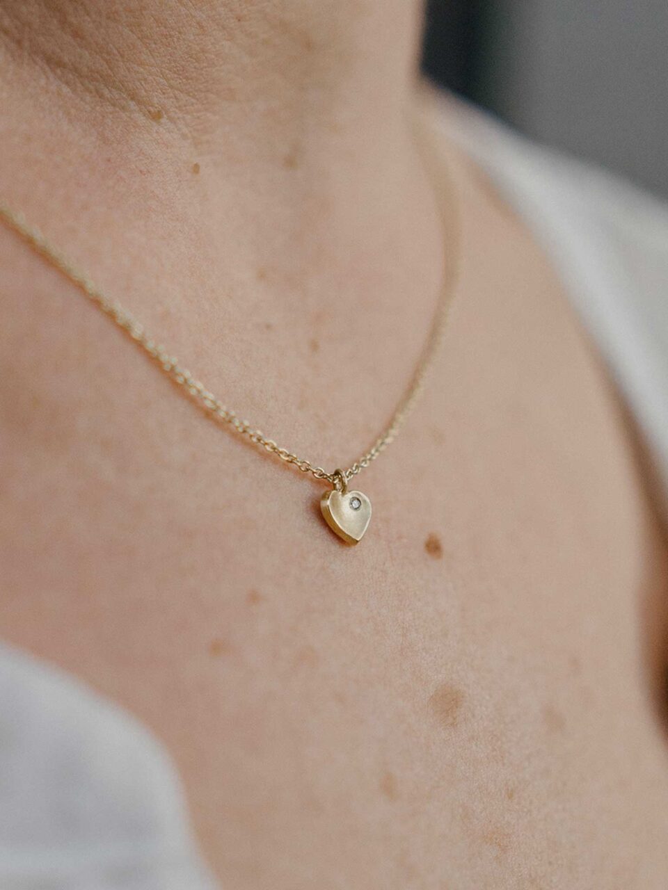 gold heart necklace with diamond