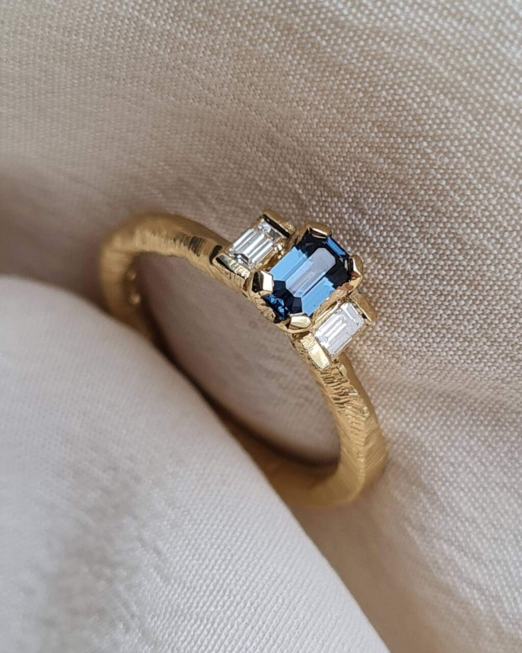 Textured-Bright-Blue-Emerald-Cut-Art-Deco-Trilogy-Spinel-Textured-Engagement-Ring-Chloe-Solomon-Clifton-Rocks