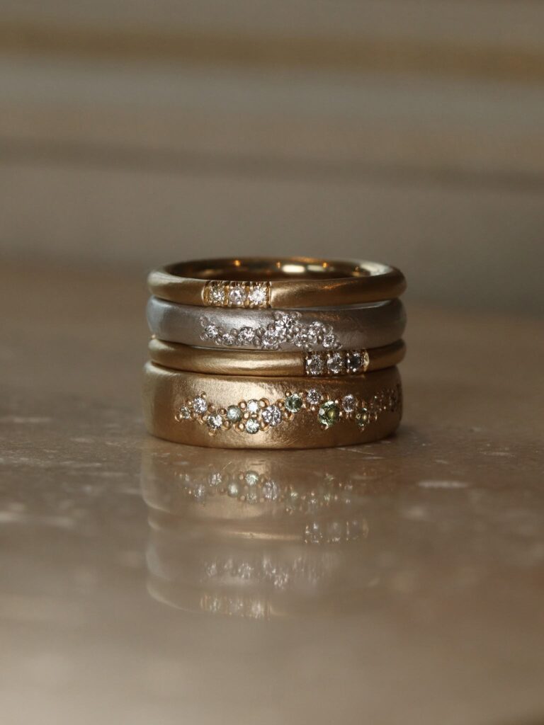 Stack of gold and diamond rings