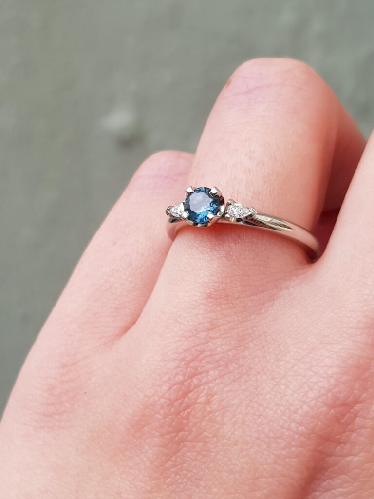 Australian teal sapphire and diamond trilogy engagement ring