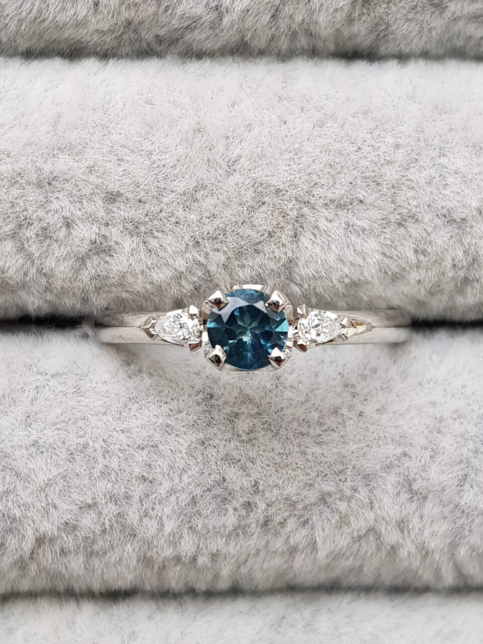 Australian teal sapphire and diamond trilogy engagement ring